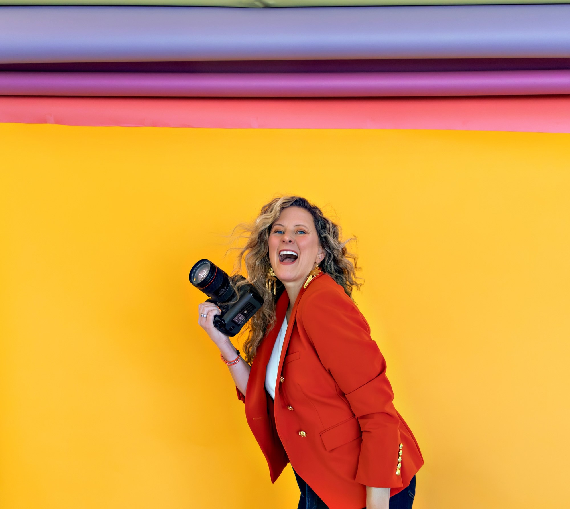 Sarah Petty Holding Camera smiling Aug