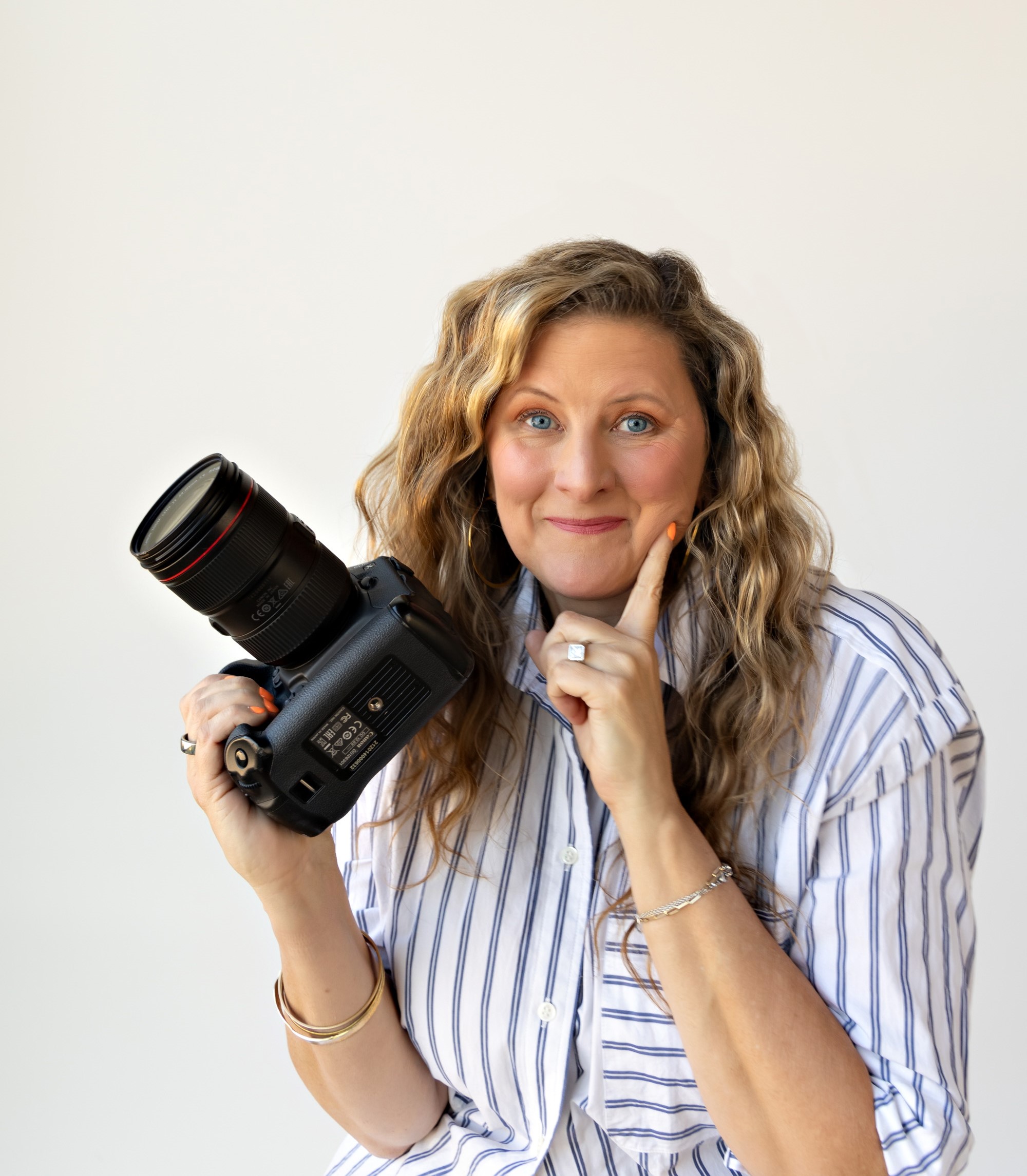Sarah Petty Thinking Face Holding Camera ()