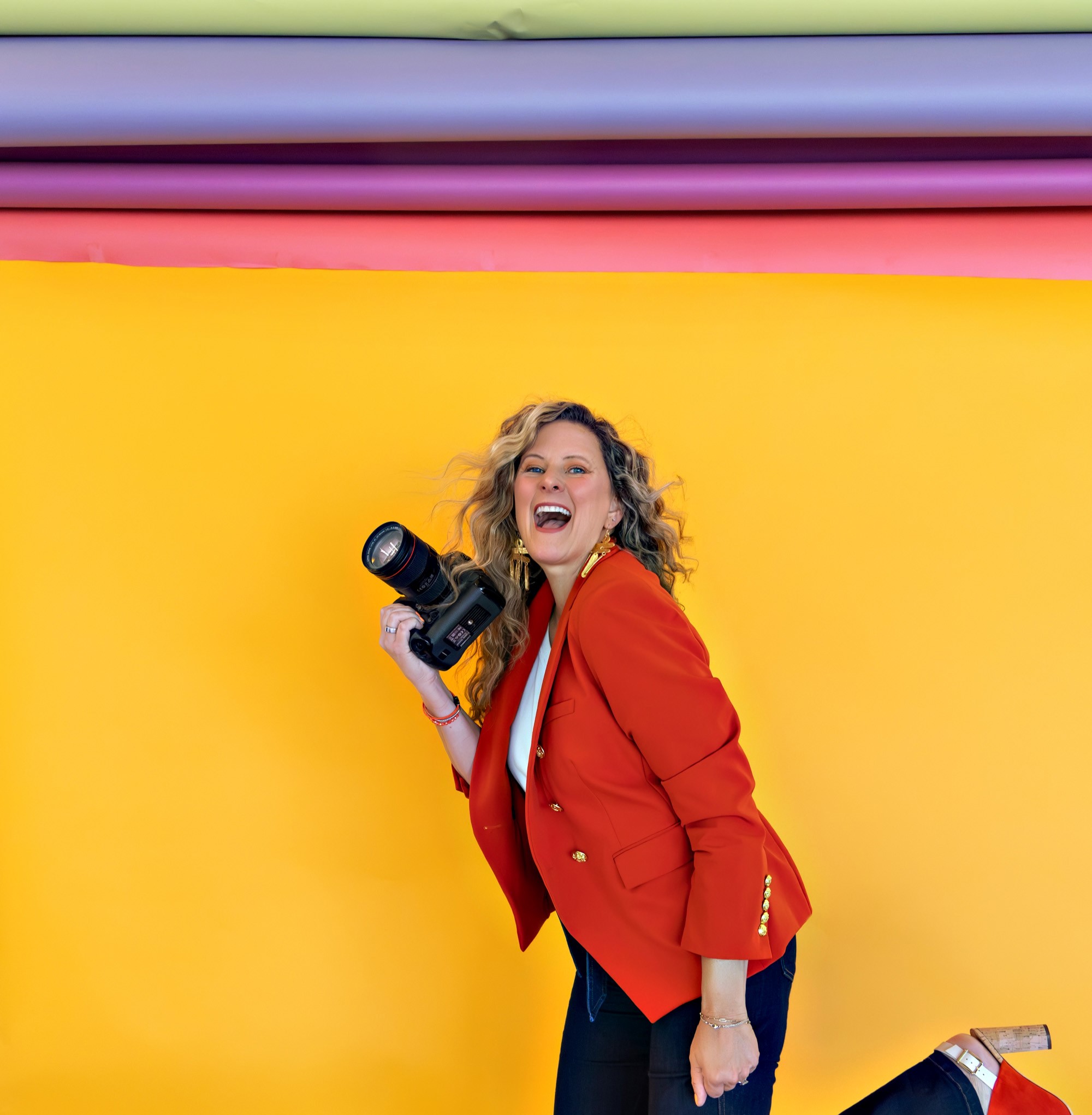 Sarah Petty Holding Camera smiling Aug ()