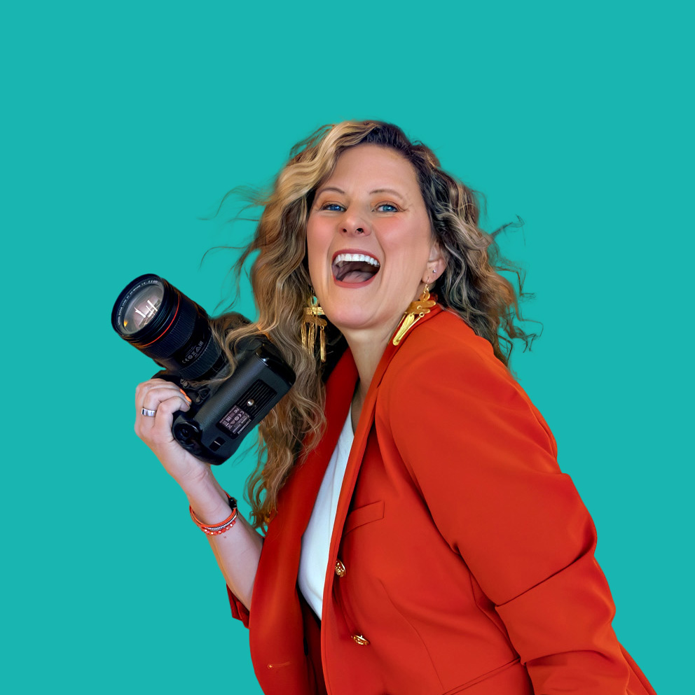 Sarah Petty Holding Camera smiling Aug SocialMediaEdit Teal
